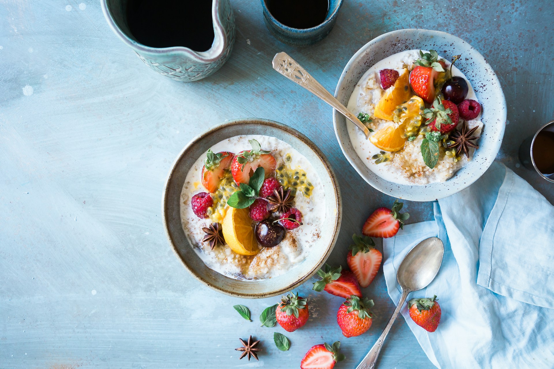 a bowl of oatmeal with fruit and berries