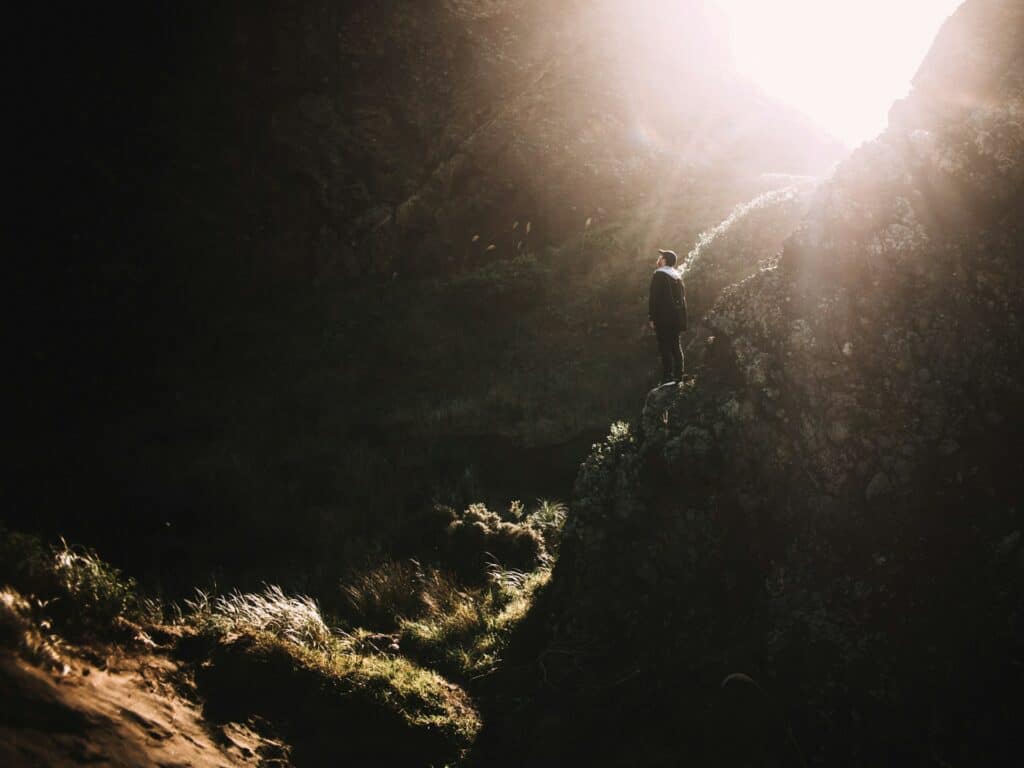 a person standing on a rock