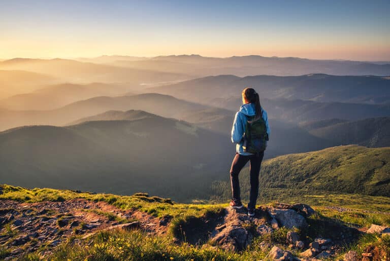 A person goes hiking in the mountains.