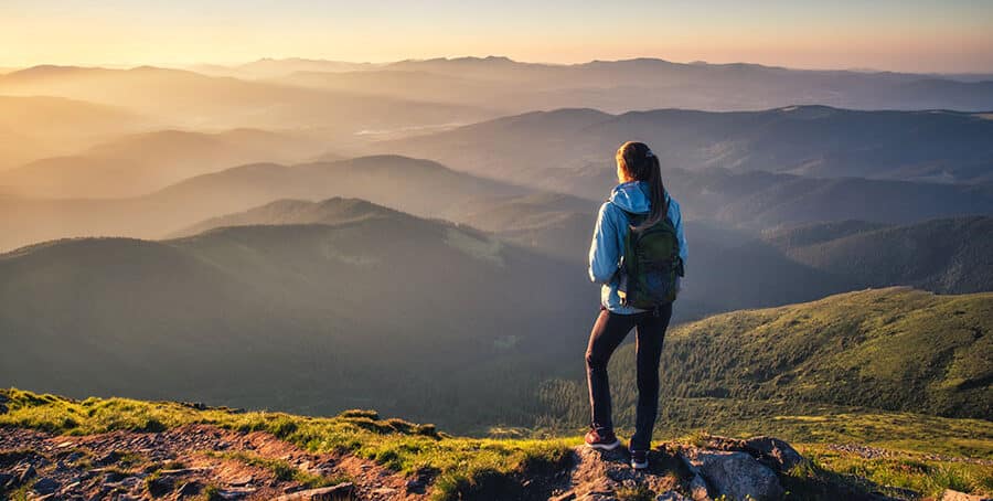 A person goes hiking in the mountains.