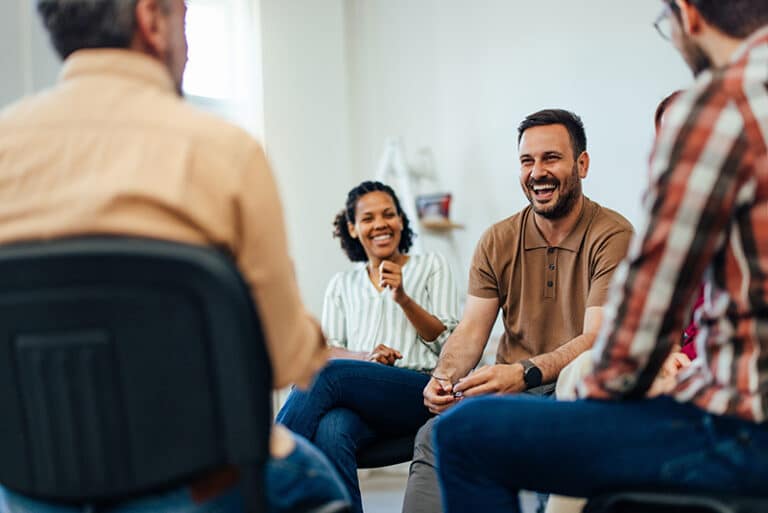 People participate in psychodrama group therapy.