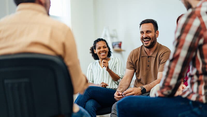 People participate in psychodrama group therapy.