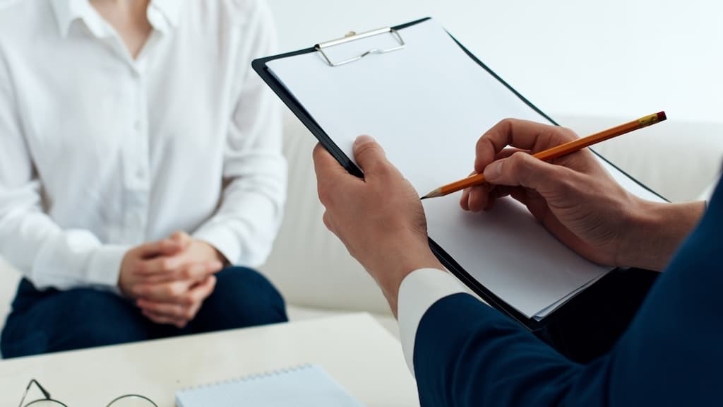 patient sits with a psychologist psychotherapy communication