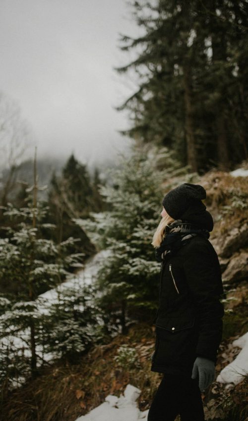 a woman standing in the snow