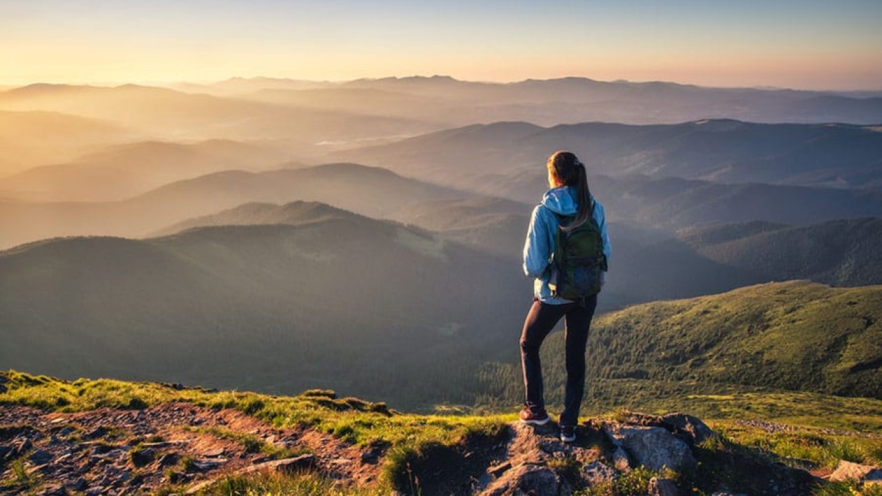A person goes hiking in the mountains.