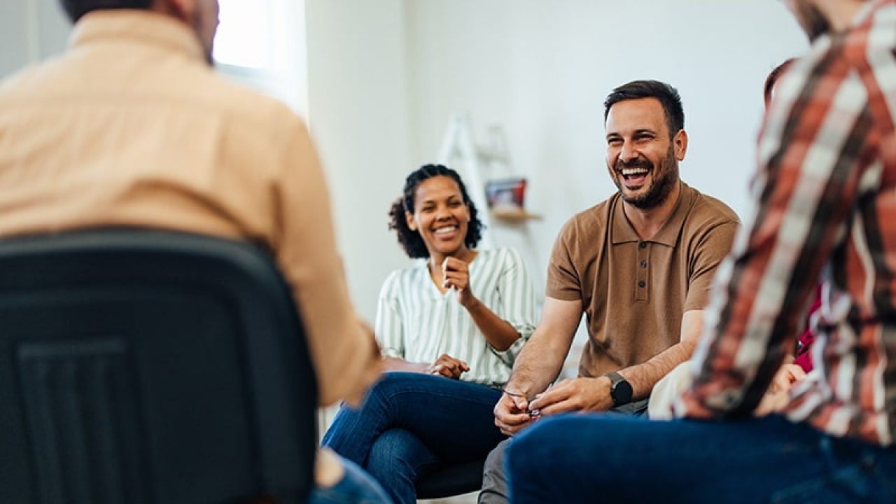 People participate in psychodrama group therapy.
